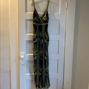 Black and gold jumpsuit by Honeypunch